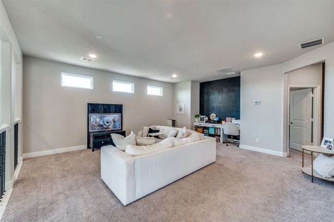 Living area with light carpet, baseboards, visible vents, and recessed lighting | Image 24