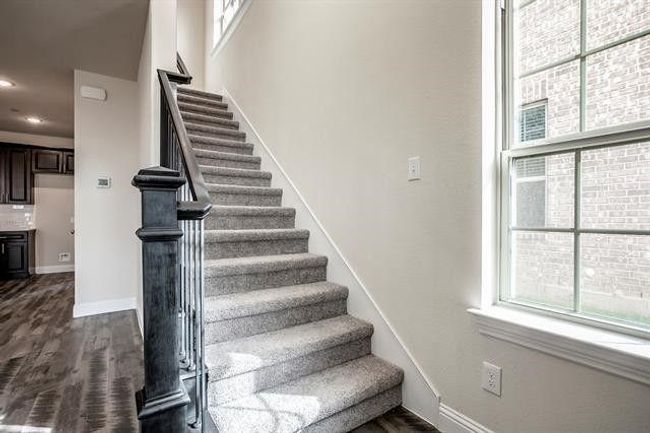 Stairway with wood finished floors, baseboards, and recessed lighting | Image 11