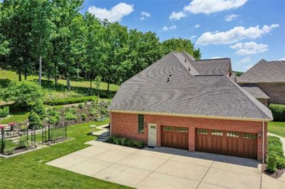 Gorgeous garage doors adorn the 3 car attached garage. | Image 2