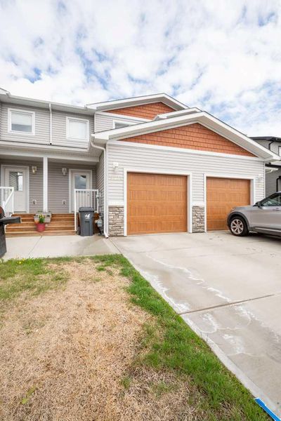 C - 9524 113 Ave, Home with 3 bedrooms, 2 bathrooms and 2 parking in Clairmont AB | Image 1