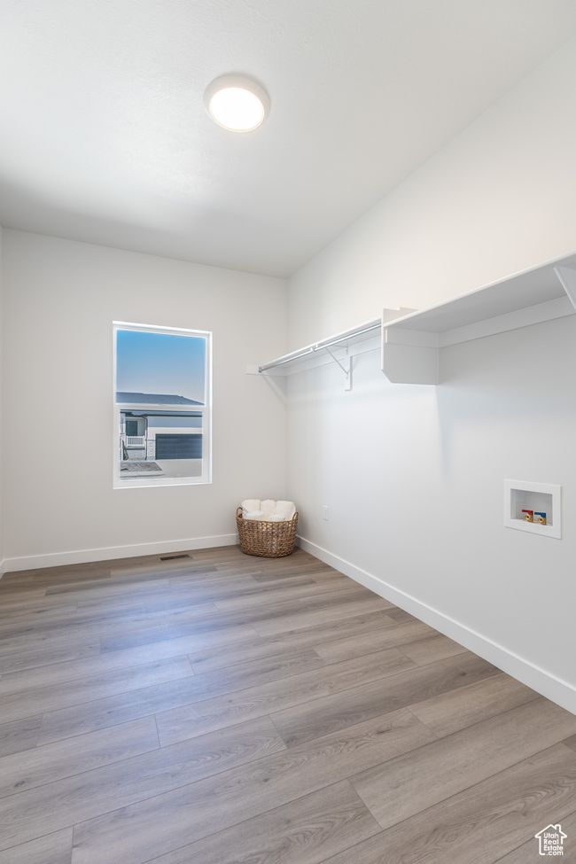 Walk in closet with wood finished floors | Image 20