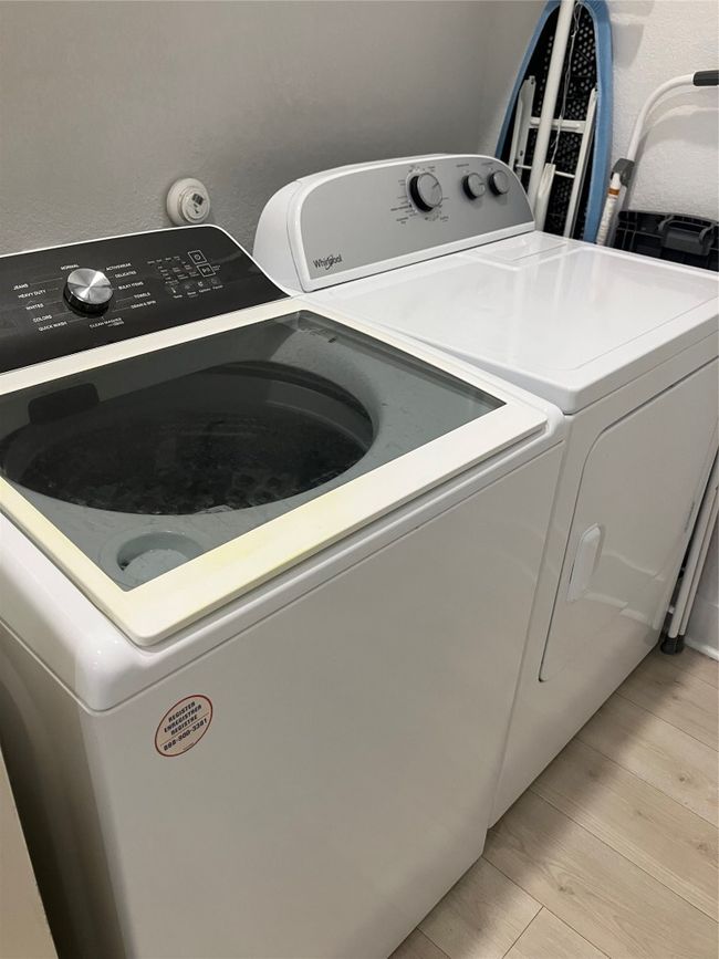 Laundry area with independent washer and dryer | Image 24