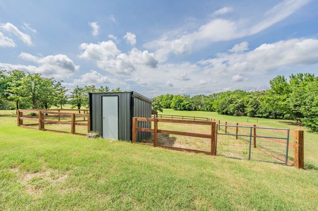 View of yard featuring a rural view and a gate | Image 9