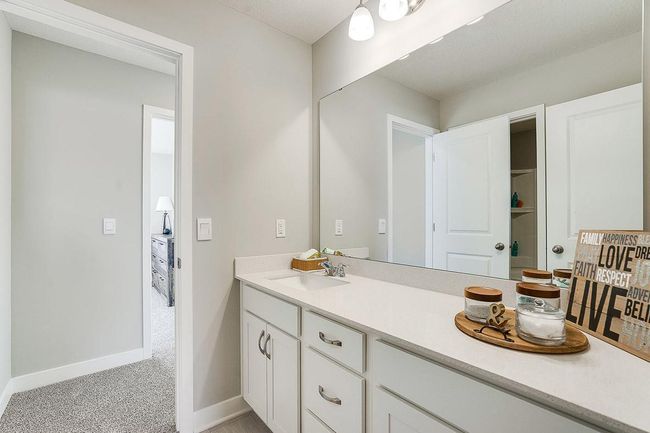 Upper-level hall bath. Stunning cabinetry with additional storage, quartz countertops and more. *Photos used are of a model home. | Image 20