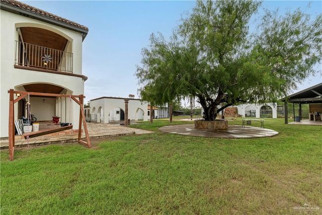 View of yard with a balcony, a gazebo, and a patio area | Image 5