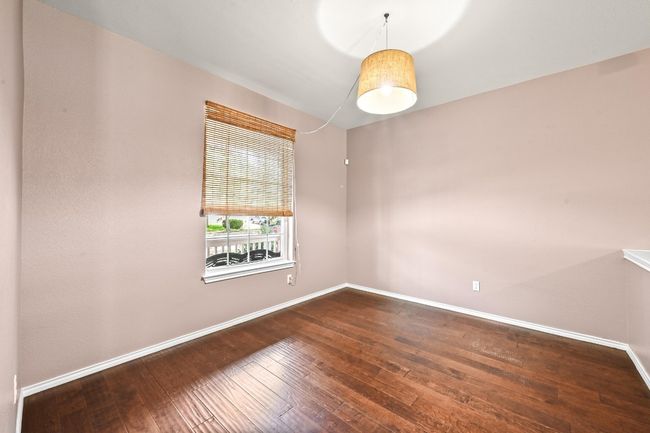 Spare room with hardwood / wood-style flooring and baseboards | Image 6