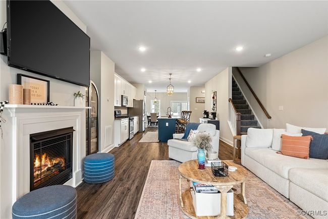 Living room with sink and dark wood-type flooring | Image 35