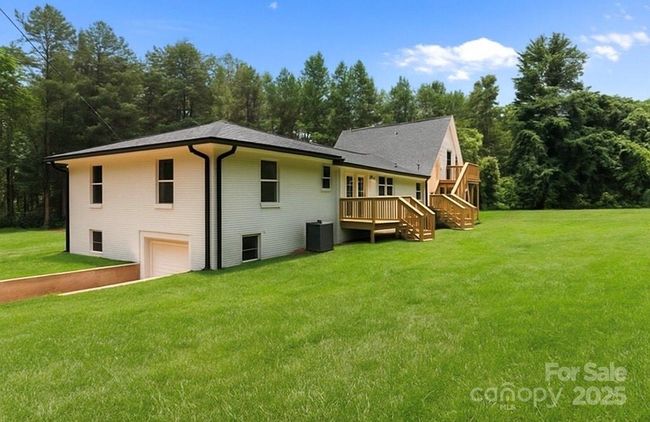 New roof, HVACS, paint, decks, renovated kitchen, double garage addition, all bathroom remodeled-this one is perfection! | Image 4