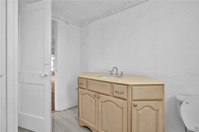 Bathroom with wood finished floors and vanity | Image 28