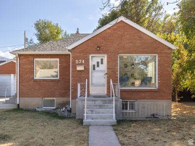 View of front facade featuring a garage and a front lawn | Image 2