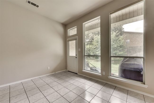 Entryway featuring plenty of natural light and light tile patterned flooring | Image 15