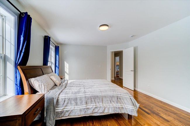 Alternate view Bedroom featuring wood finished floors and baseboards | Image 31