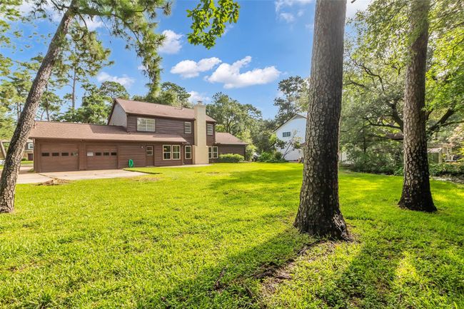 Large oversized 2 car garage in the back. | Image 38