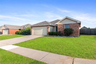 Single story home with a garage and a front yard | Image 3