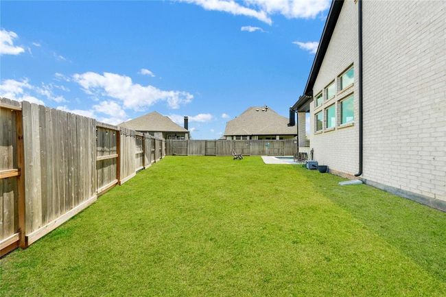 Full gutters front and side ad back! Extra side yard on oversized massive lot! | Image 45