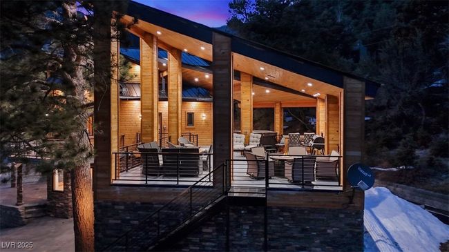Back of property at dusk featuring a patio area and stairway | Image 12