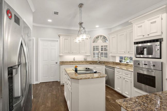 Laundry room is through the door to the back of the kitchen. | Image 18