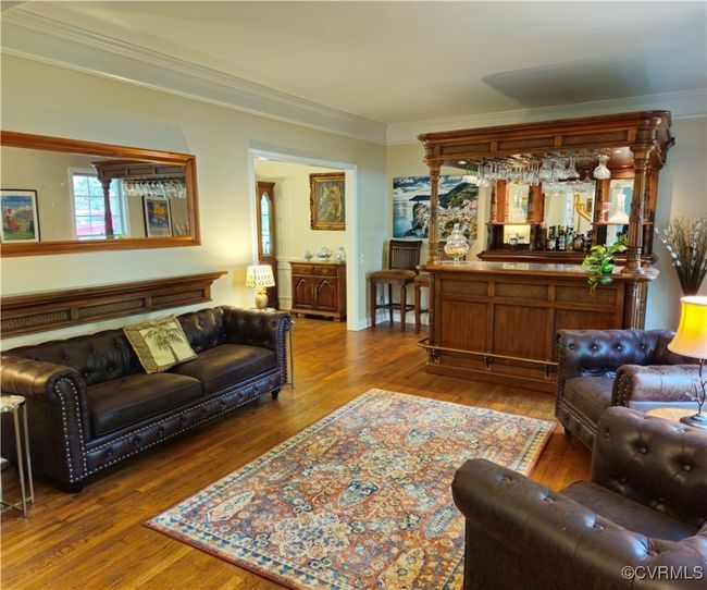 Home office with crown molding and wood finished floors | Image 13