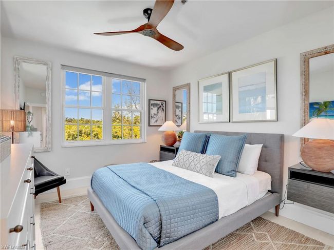 Bedroom featuring ceiling fan | Image 23