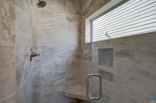 Tile walk-in shower in primary bathroom. | Image 29