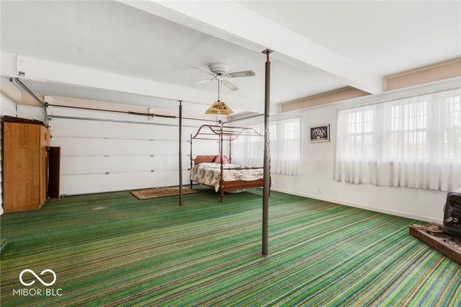 bedroom featuring carpet flooring and beam ceiling | Image 17