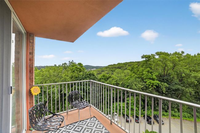 Balcony featuring a forest view | Image 34
