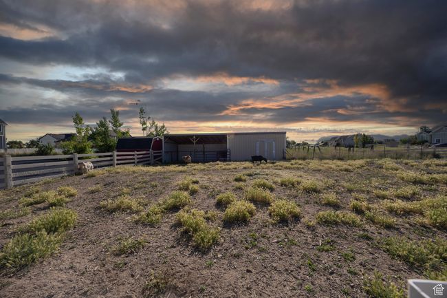 View of yard with an outdoor structure and a pole building | Image 99