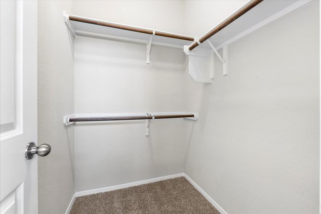 Spacious closet featuring carpet floors | Image 18