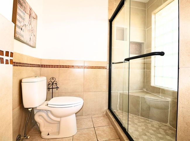 Upgraded master shower including a sleek new shower door | Image 12