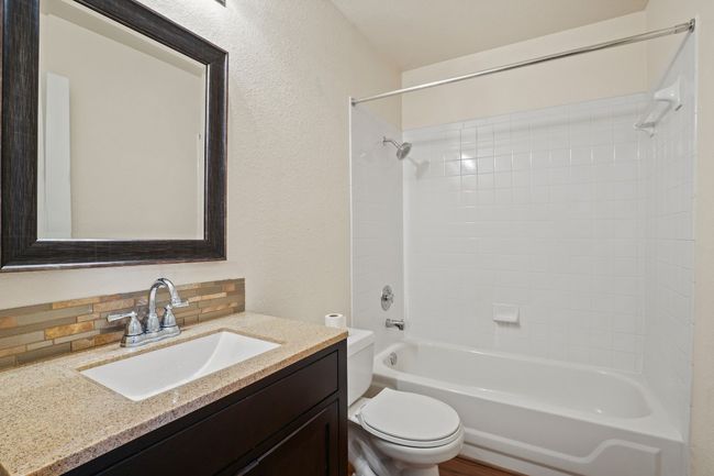 The secondary bathroom offers a clean, functional layout with a tub/shower combo. 9349 Bernoulli Dr., Austin, TX 78748 | Image 28
