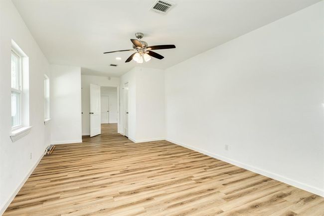 Another view of the oversized primary bedroom equipped with two closets | Image 12