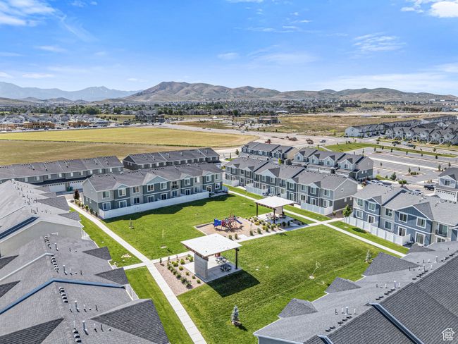 Aerial view of residential area featuring a mountain backdrop | Image 32