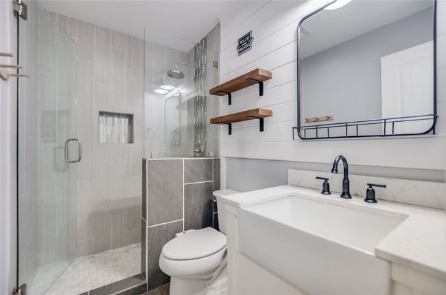 Full bath featuring a shower stall and vanity | Image 18