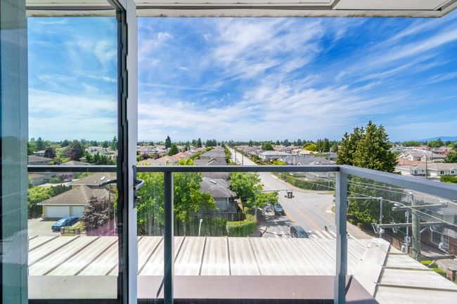 Wooden deck with a residential view | Image 21