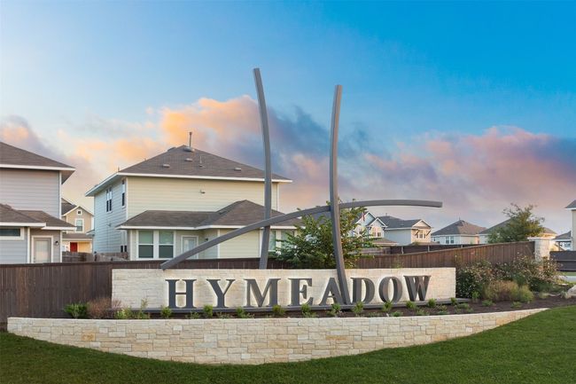 Community sign with fence and a residential view | Image 4