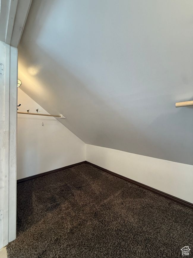 Walk in closet with carpet floors and vaulted ceiling | Image 27