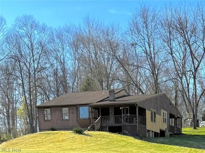 View of front of property featuring a front lawn | Image 1