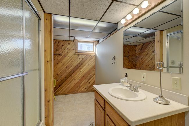 The lower level features a convenient 3/4 bath, adding extra comfort and functionality to your space | Image 23