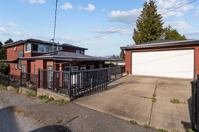 Detached garage featuring fence | Image 38