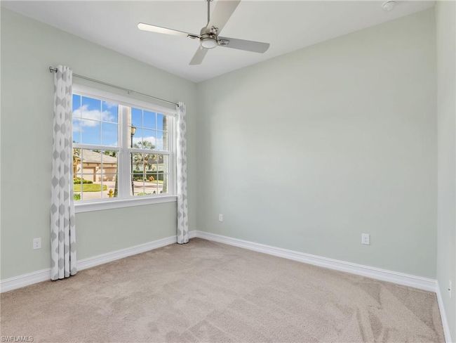 Unfurnished room featuring light carpet and ceiling fan | Image 30