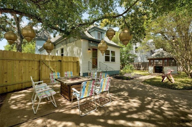 Back patio terrace with an outdoor fire pit and a gazebo | Image 30