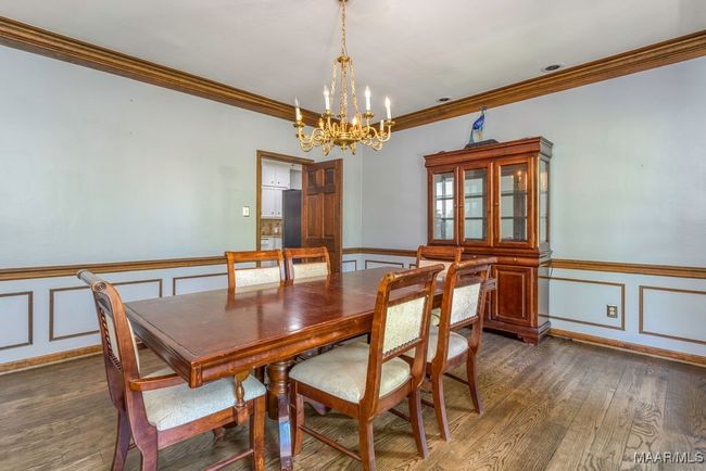 Formal dining room with wainscoting and deep crown moulding | Image 16
