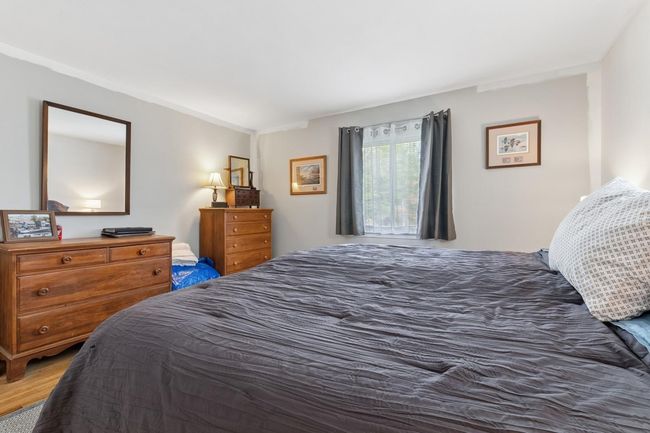 Bedroom with wood finished floors | Image 15