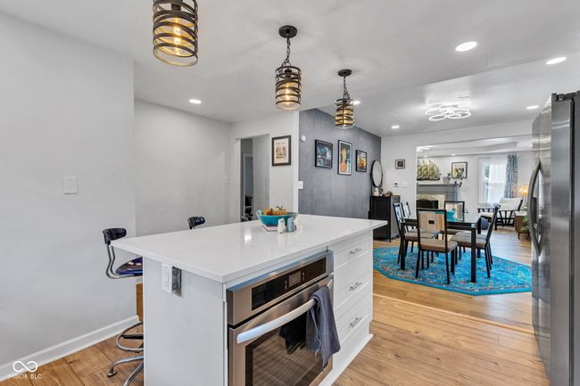 View from back kitchen wall into dining and living area. | Image 13