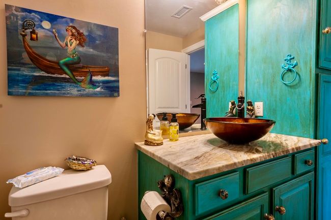 Bathroom featuring vanity, toilet, and visible vents | Image 33