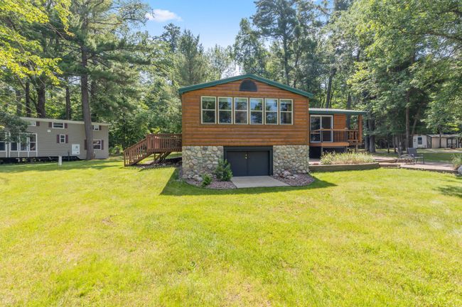 In between guest cabin and primary residence you'll see an additional RV hookup complete with sewer and water. This property is ready for your gatherings and/or can also be rented out with a license from the county. | Image 21