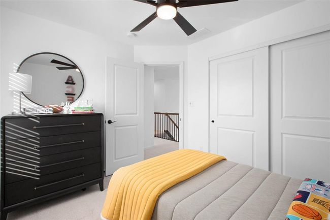 Carpeted bedroom featuring a closet and ceiling fan | Image 22