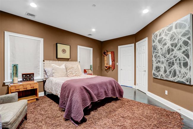 Bedroom with wood finished floors, baseboards, and recessed lighting | Image 19