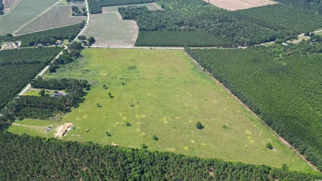 Aerial overview of property's location featuring rural landscape and extensive farmland | Image 4