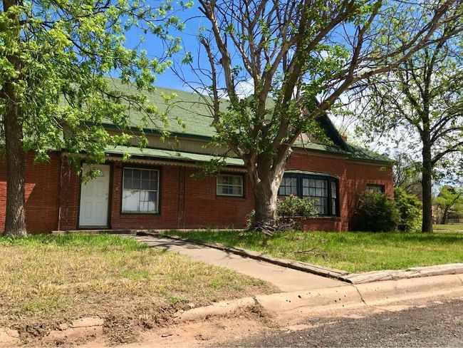 View of front of house with brick siding and a front lawn | Image 18